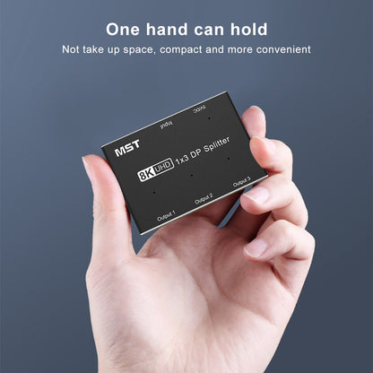 Compact MOSHOU 1x3 DisplayPort MST hub held in one hand